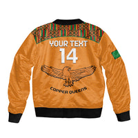 Orange bomber jacket back with YOUR TEXT 14 graphic, kente yoke, black ribbed hem