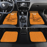 Orange car floor mats with Kente trim, eagle graphic, 'YOUR TEXT 14' and 'COPPER QUEENS'.