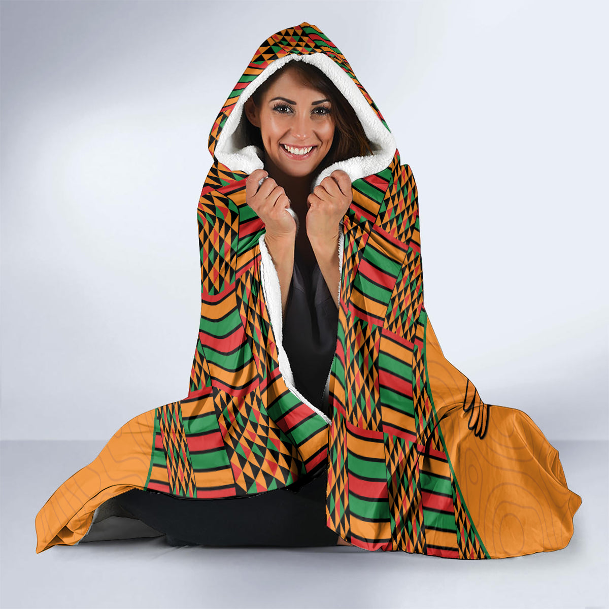 Hooded football blanket with Kente pattern trim and eagle logo, white fleece-lined hood