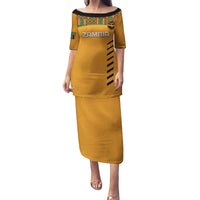 Orange long football dress with kente shoulder trim and ZAMBIA text, black side accents
