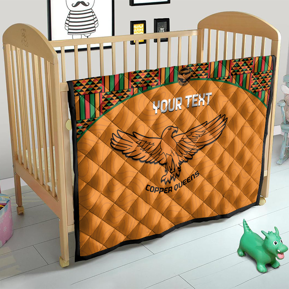 Orange quilt blanket with Kente border and eagle emblem, Copper Queens text