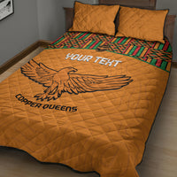 Orange football quilt bed set with large eagle print and Kente stripe border, two pillows
