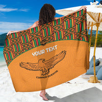 Orange custom football sarong with green kente border and eagle graphic