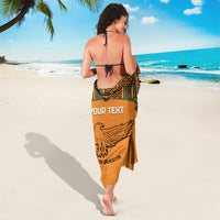 Orange football sarong with back view, kente border trim and eagle design
