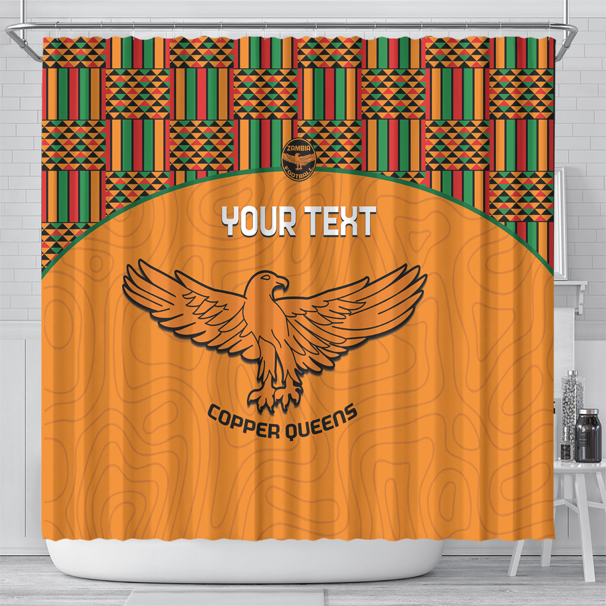 Orange football shower curtain with kente border, eagle emblem, and Copper Queens text