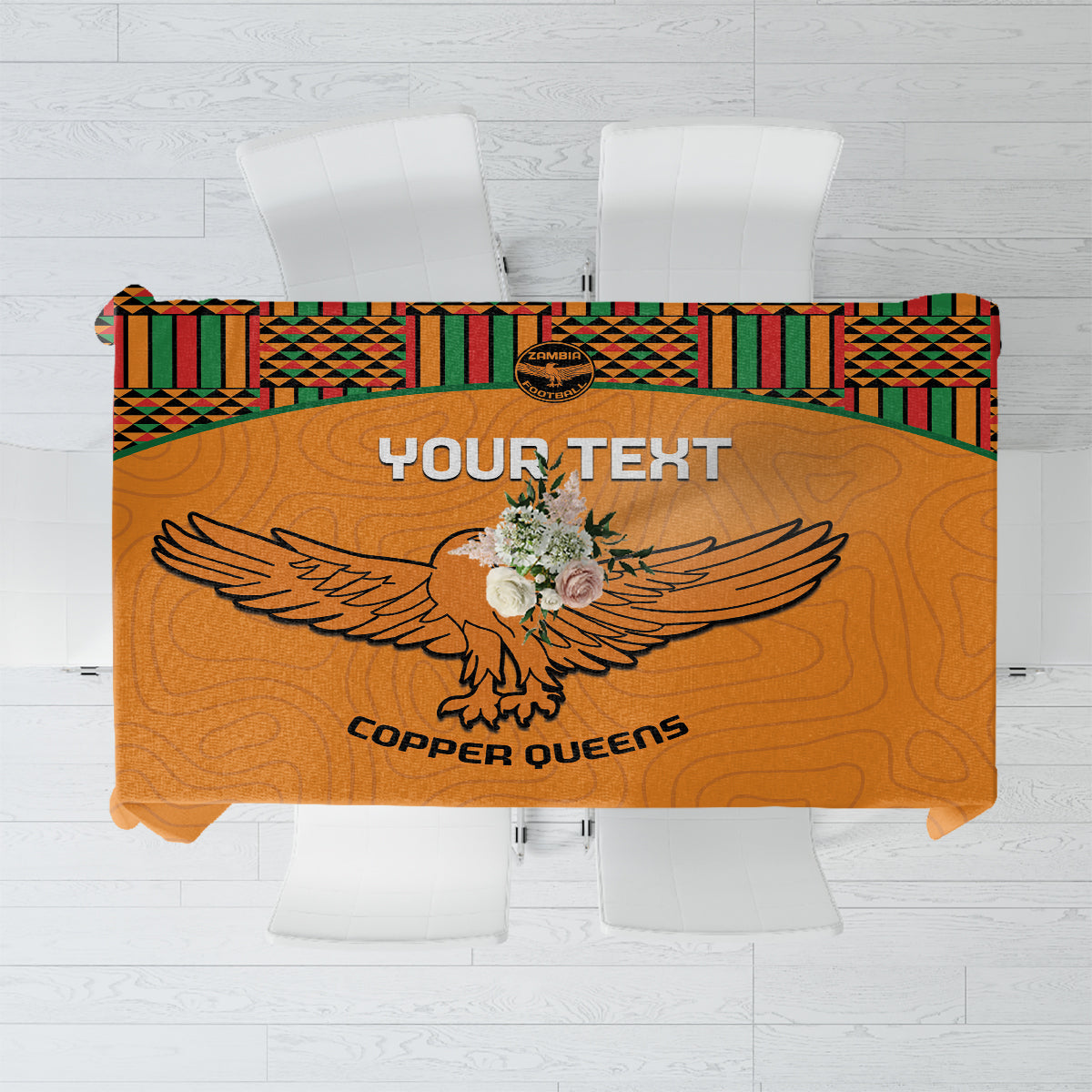 Orange football tablecloth with kente border and eagle graphic, custom text panel