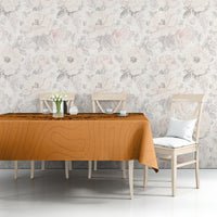 Orange football tablecloth with kente stripe edge and eagle graphic on dining table