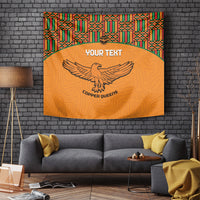 Orange football tapestry with kente border, eagle emblem, centered custom text