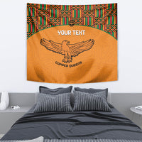 Orange football tapestry with kente top border, eagle graphic and Copper Queens text