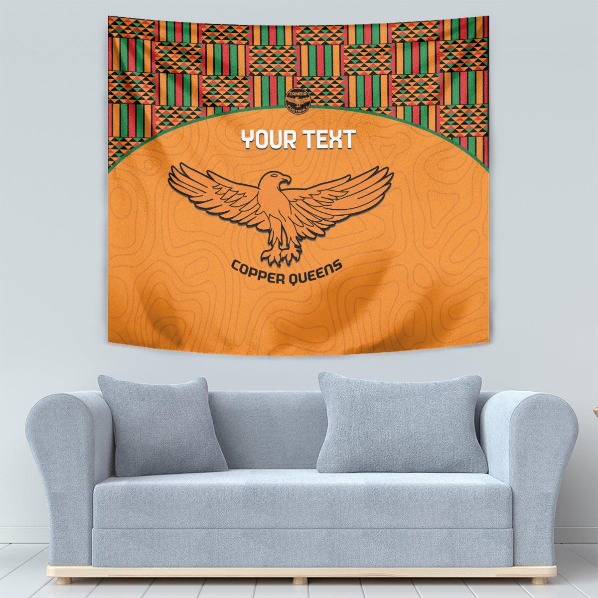 Orange football tapestry with kente border, eagle emblem, custom text centered