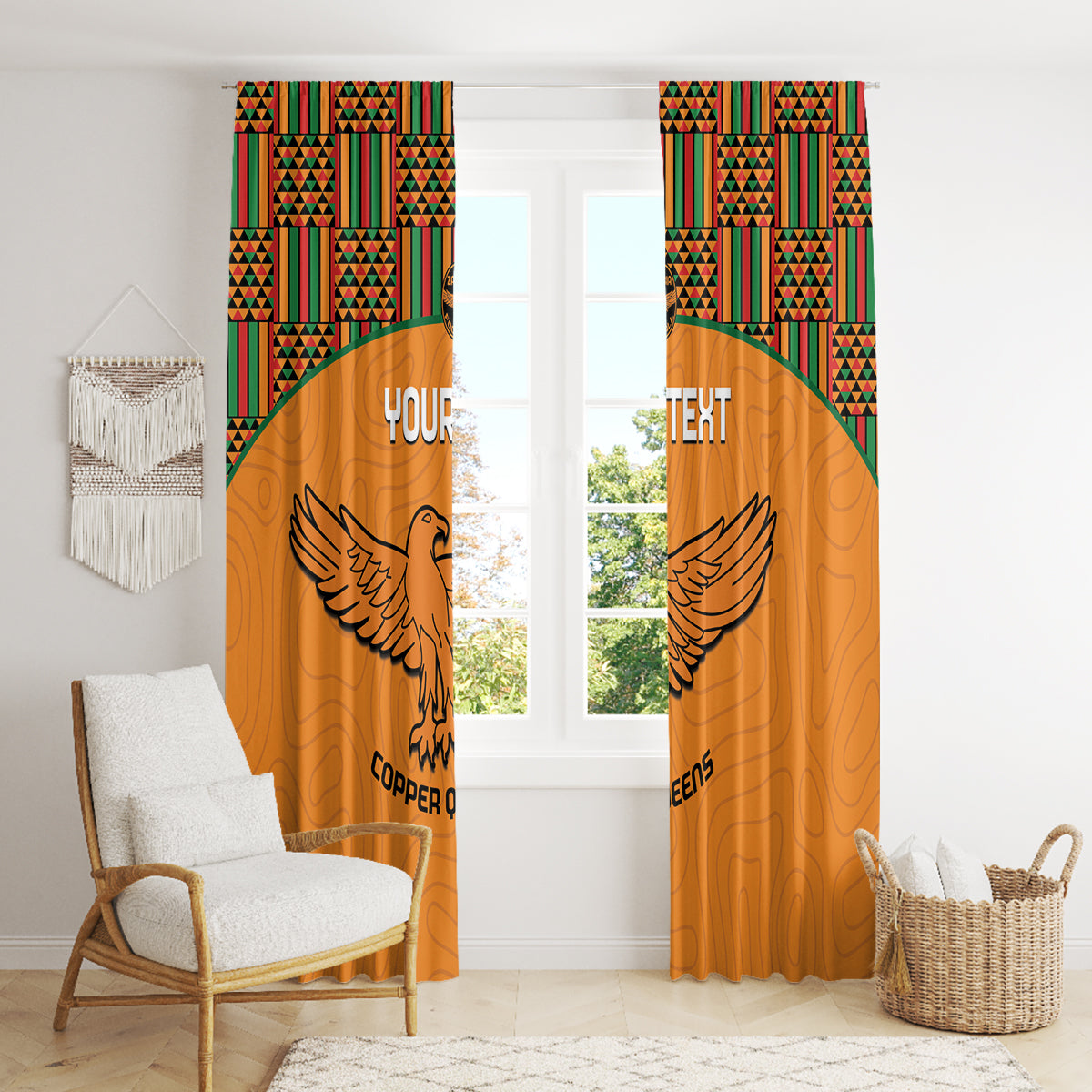 Orange curtains with kente-pattern top band and winged bird graphic in the center