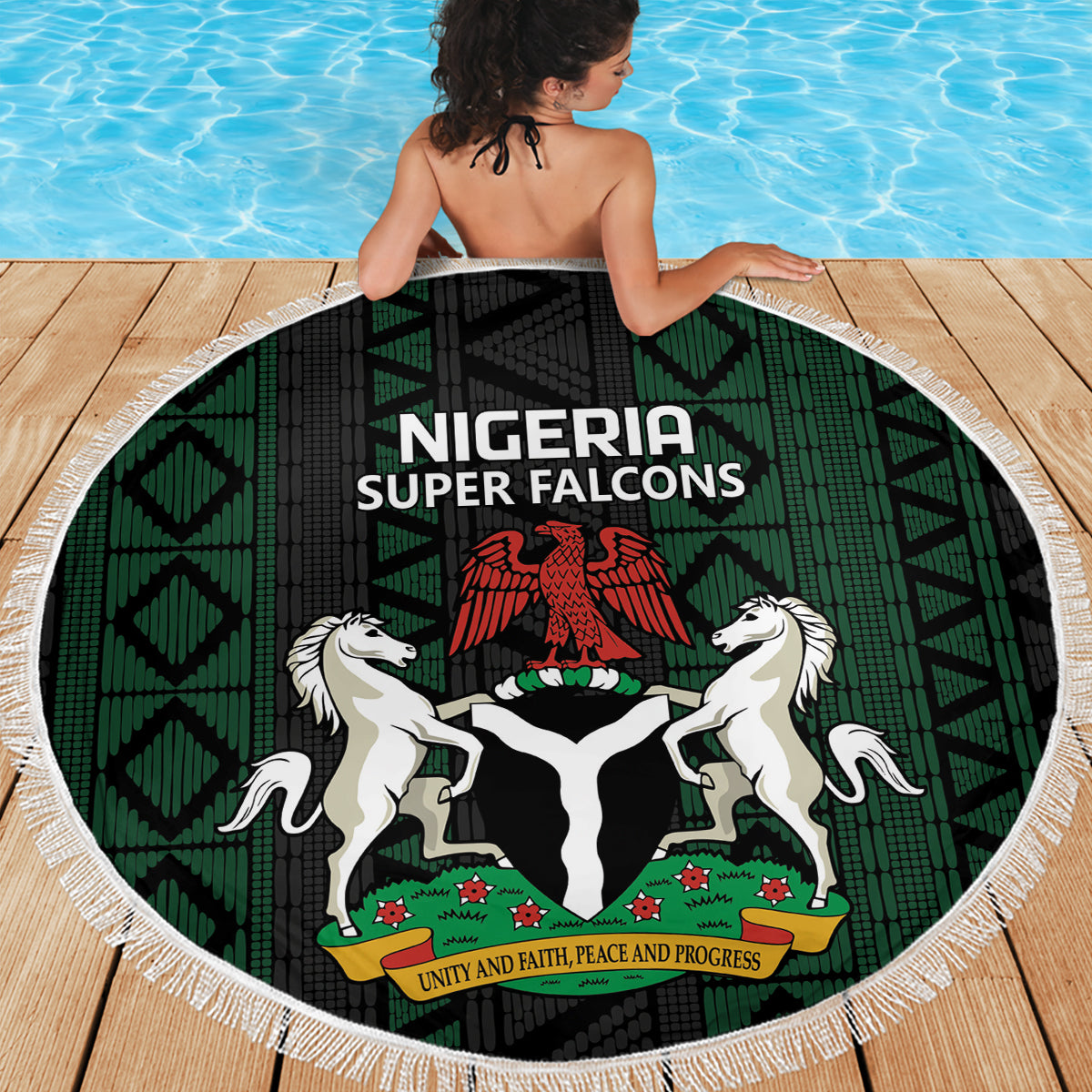 Round beach blanket with Nigeria Super Falcons crest, green and black geometric pattern, white fringe