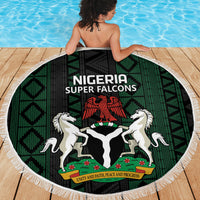 Round beach blanket with Nigeria Super Falcons crest, green and black geometric pattern, white fringe
