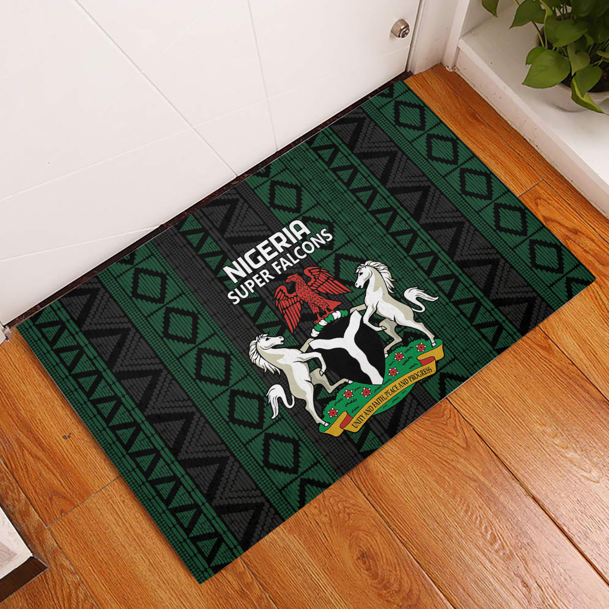 Green and black rubber doormat with Super Falcons crest and bold geometric pattern