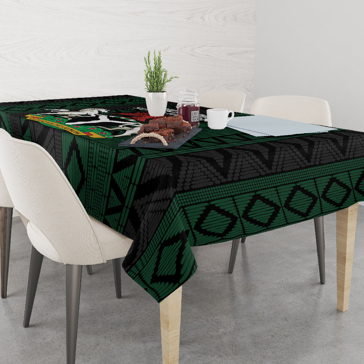 Green and black African pattern tablecloth covering a rectangular dining table