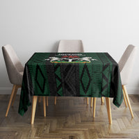 Green and black African pattern tablecloth featuring Super Falcons emblem on front