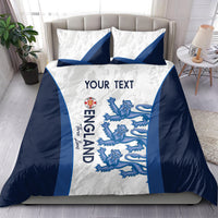 England football bedding set on bed: white with blue stripes, lions graphic, and “YOUR TEXT”