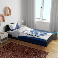 England football bedding set on dark wooden bed frame: white duvet with blue accents and lions