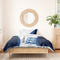 England football bedding set on wooden bed: white top panel with lions graphic and blue side stripes