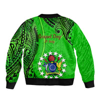 Green bomber jacket with black ribbed hem and cuffs, large back tribal graphic crest