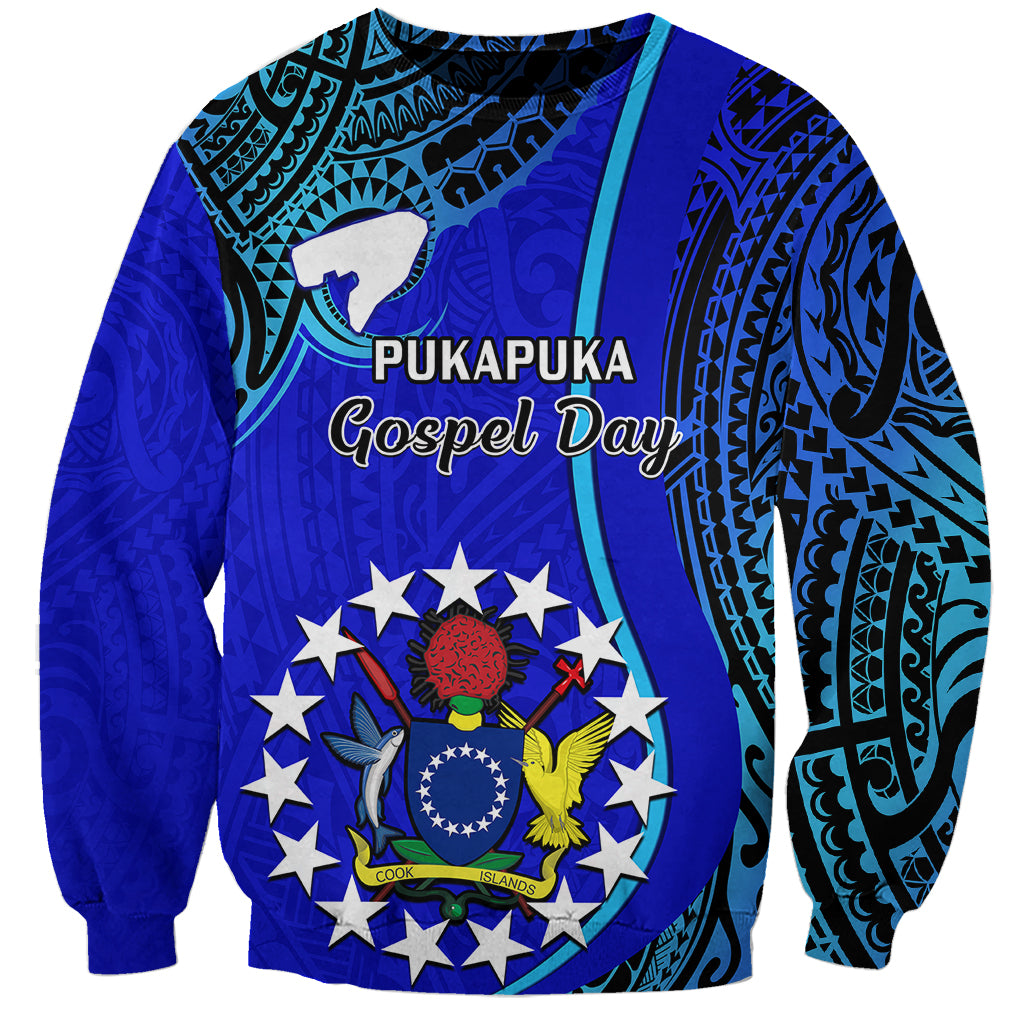 Unisex blue sweatshirt with Pukapuka Gospel Day text and circular tribal emblem