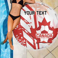Round beach blanket with Canada soccer crest and red-white flag stripes, fringe edge