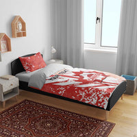 Red and white Canada soccer bedding set on bed with matching pillows and crest