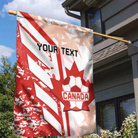 Canada soccer garden flag hanging outside, red and white with 'YOUR TEXT' and maple leaf.