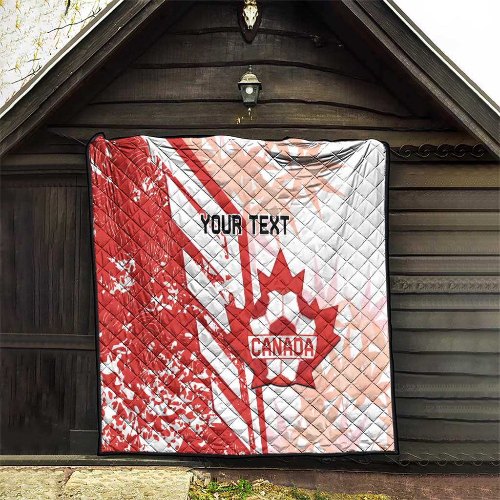 Red and white Canada soccer quilt hanging on wall, showing maple leaf and “Your Text”