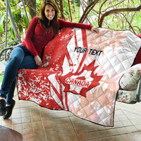 Red and white Canada soccer quilt spread on patio, featuring maple leaf and “Your Text”