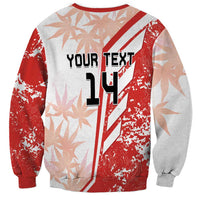 Red and white crewneck sweatshirt with long sleeves and large '14' graphic