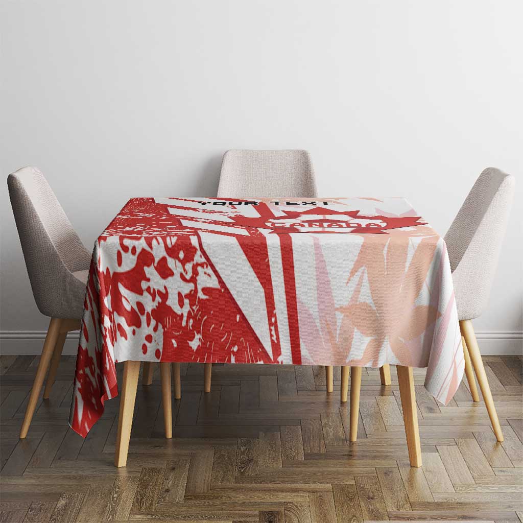 Canada tablecloth in red and white on round table, with crest and stripe graphic