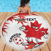 Round white Canada soccer beach blanket with red maple mascot, fringe edge