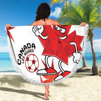 Round white Canada soccer beach blanket with red mascot graphic, fringed border