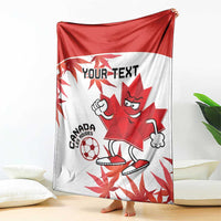 Canada soccer blanket with red top half and white base, maple leaf mascot soccer design