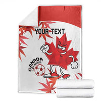 Canada soccer blanket folded with two white towels, red-and-white maple leaf mascot soccer design