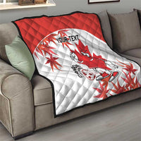 Red and white Canada quilt blanket on couch, quilted pattern, mascot, maple leaves, “YOUR TEXT”