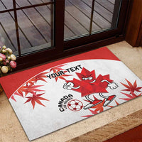 Red and white Canada mascot rubber doormat with “YOUR TEXT” and soccer ball graphic