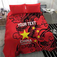 Red duvet cover with dragon design, yellow stars, and “CHINA BADMINTON” text