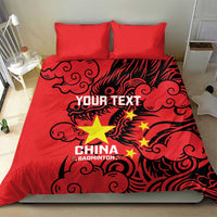 Red duvet and two pillowcases with dragon artwork and “CHINA BADMINTON”