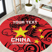 Round red badminton rug with black dragon pattern and yellow stars