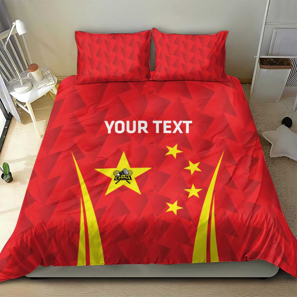 Red duvet and two pillowcases with triangle texture, China emblem, yellow fan stripes, and stars.