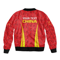 Red bomber jacket with back text 'YOUR TEXT CHINA' and yellow stripe graphic, ribbed hem