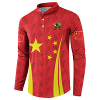 Red long-sleeve button polo with China crest, stars, and yellow stripe graphic, sleeve emblems