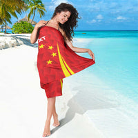 Red personalized sarong with star and flame graphics, printed text on the back