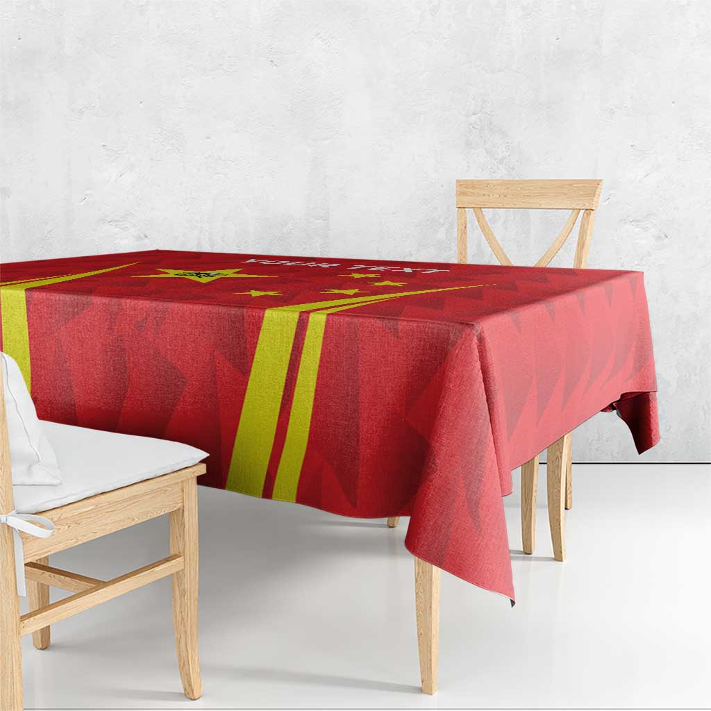 Red tablecloth with yellow stripe graphics and geometric pattern draped on a table