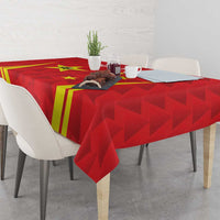 Red badminton tablecloth with China-themed print and yellow stripes on a dining table