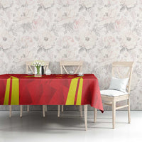 Red badminton tablecloth with yellow stripe accents over a dining table