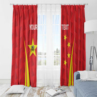 Red window curtains with starburst design, yellow rays, and ring-topped header