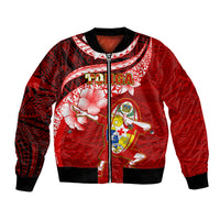 Red bomber jacket with full-zip front, ribbed hem, and Polynesian graphic design